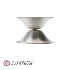 Side profile of two Silverette nursing cups stacked base to base, showing their slim low-profile shape